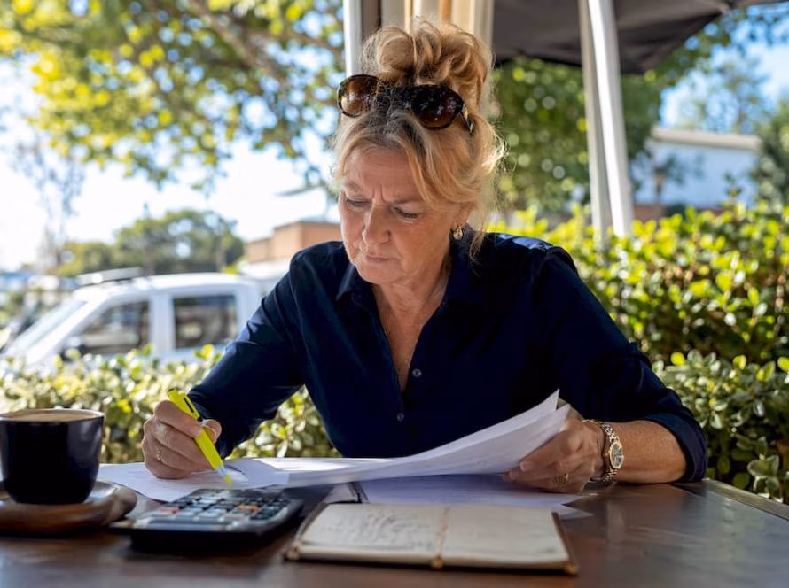 Woman reviewing horse float insurance documents