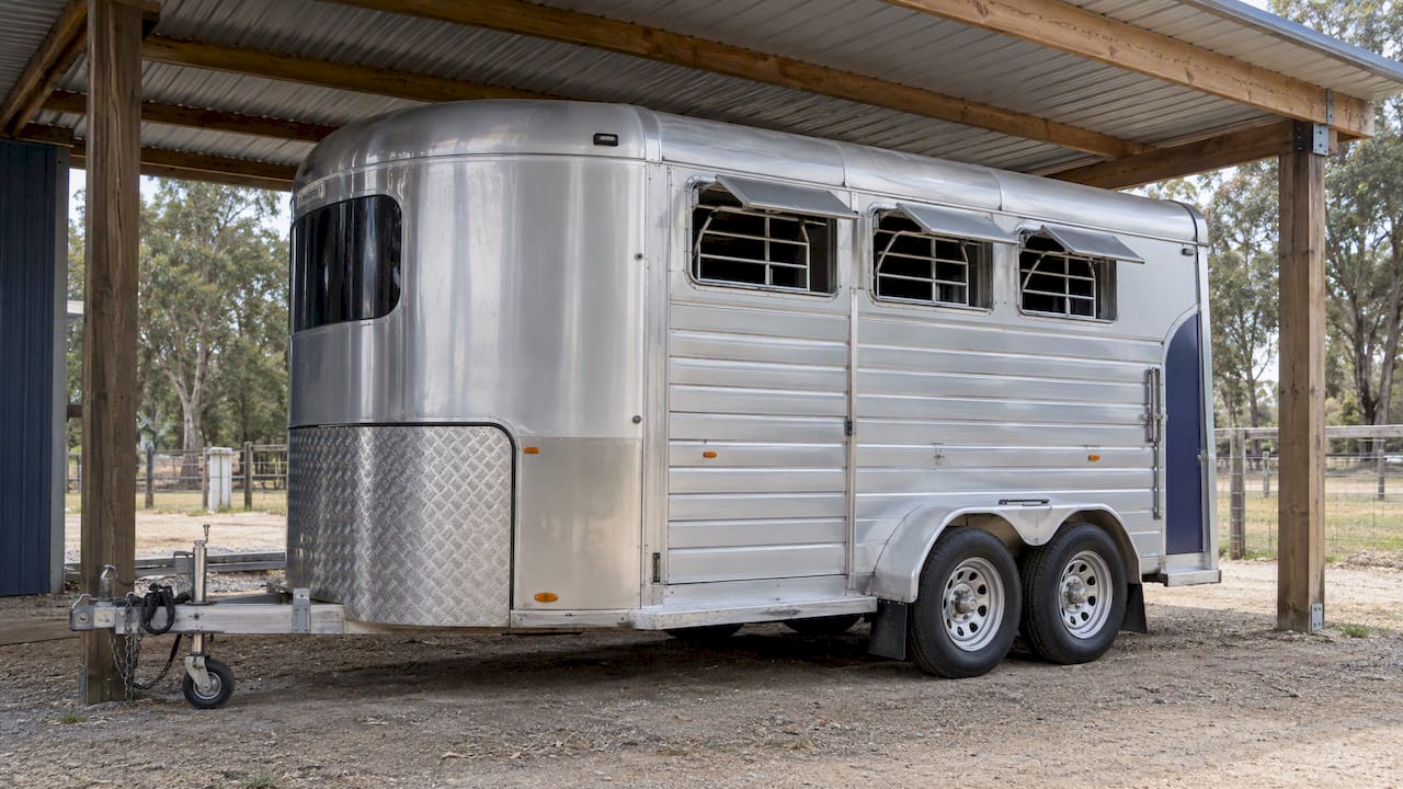 Horse float stored under a ventilated carport